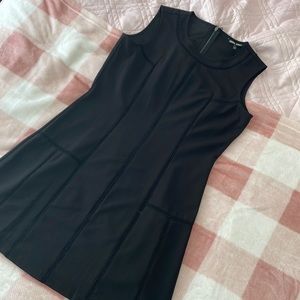 Small black cocktail dress. Zipper on the back. Worn only a few times.